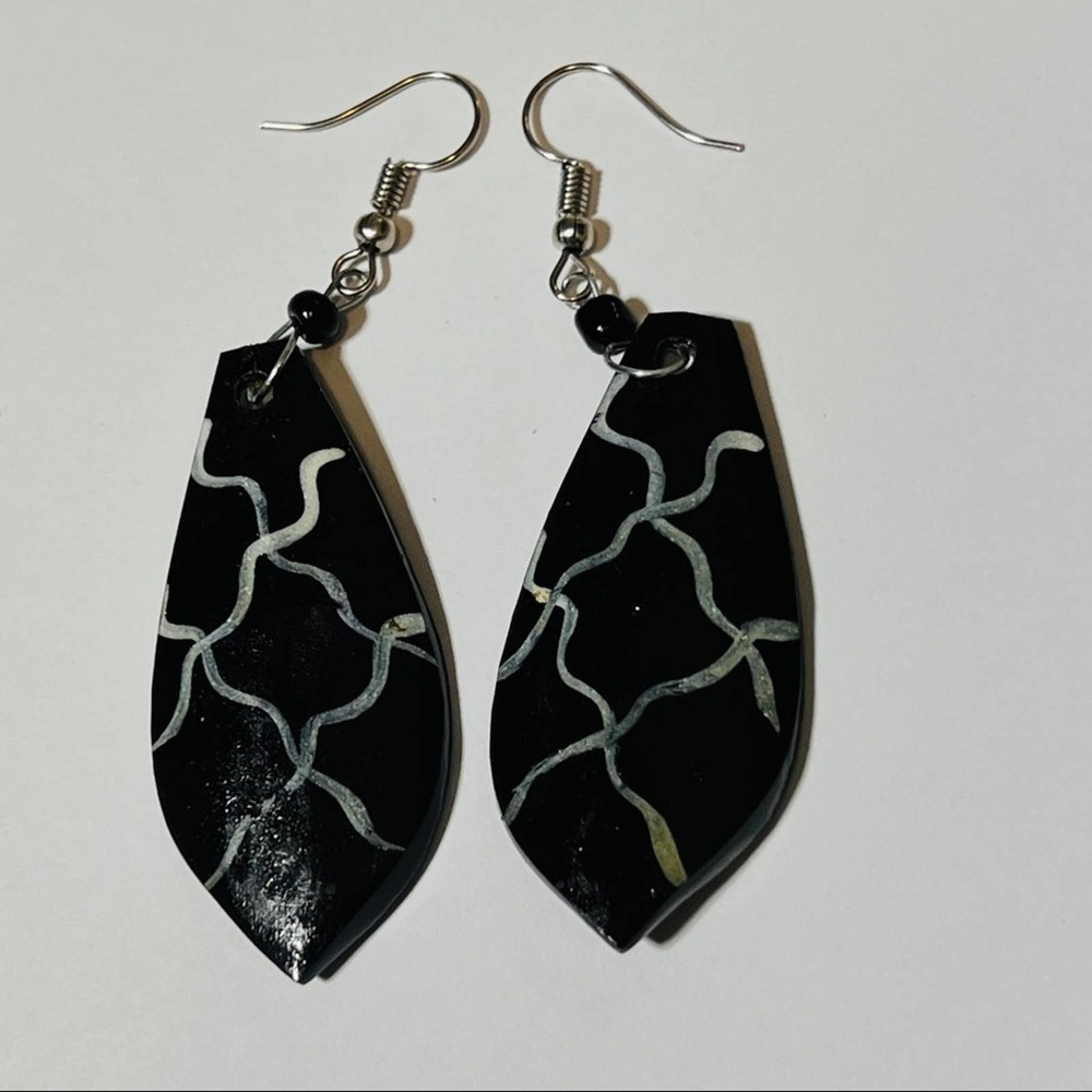Horn earrings handmade in Africa. Benefits Charity